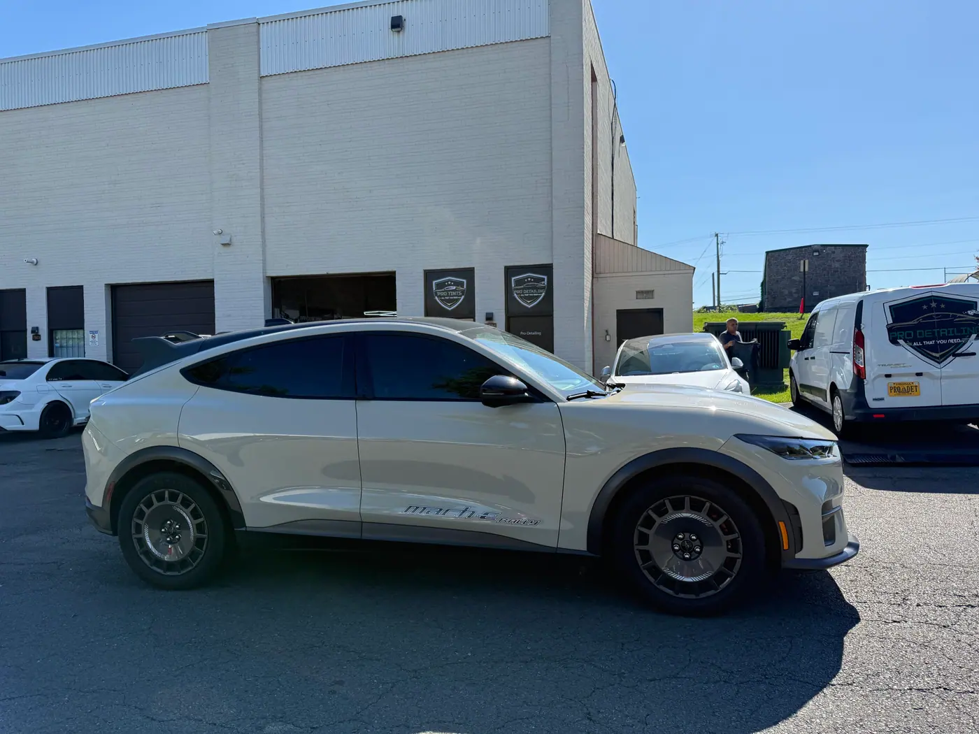 Cream crossover with tinted windows, photographed side-on.