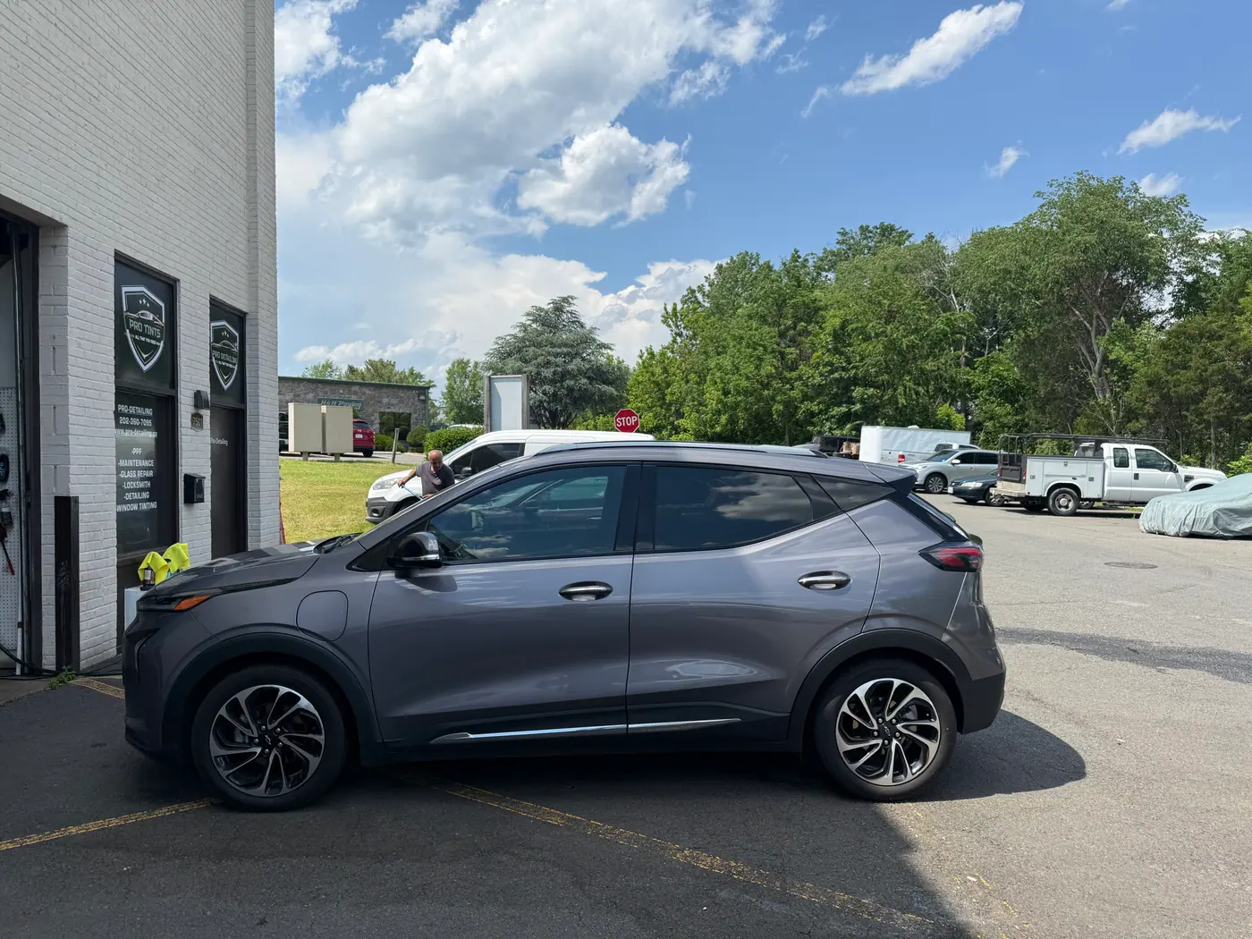 Grey crossover with tinted windows, photographed side-on.