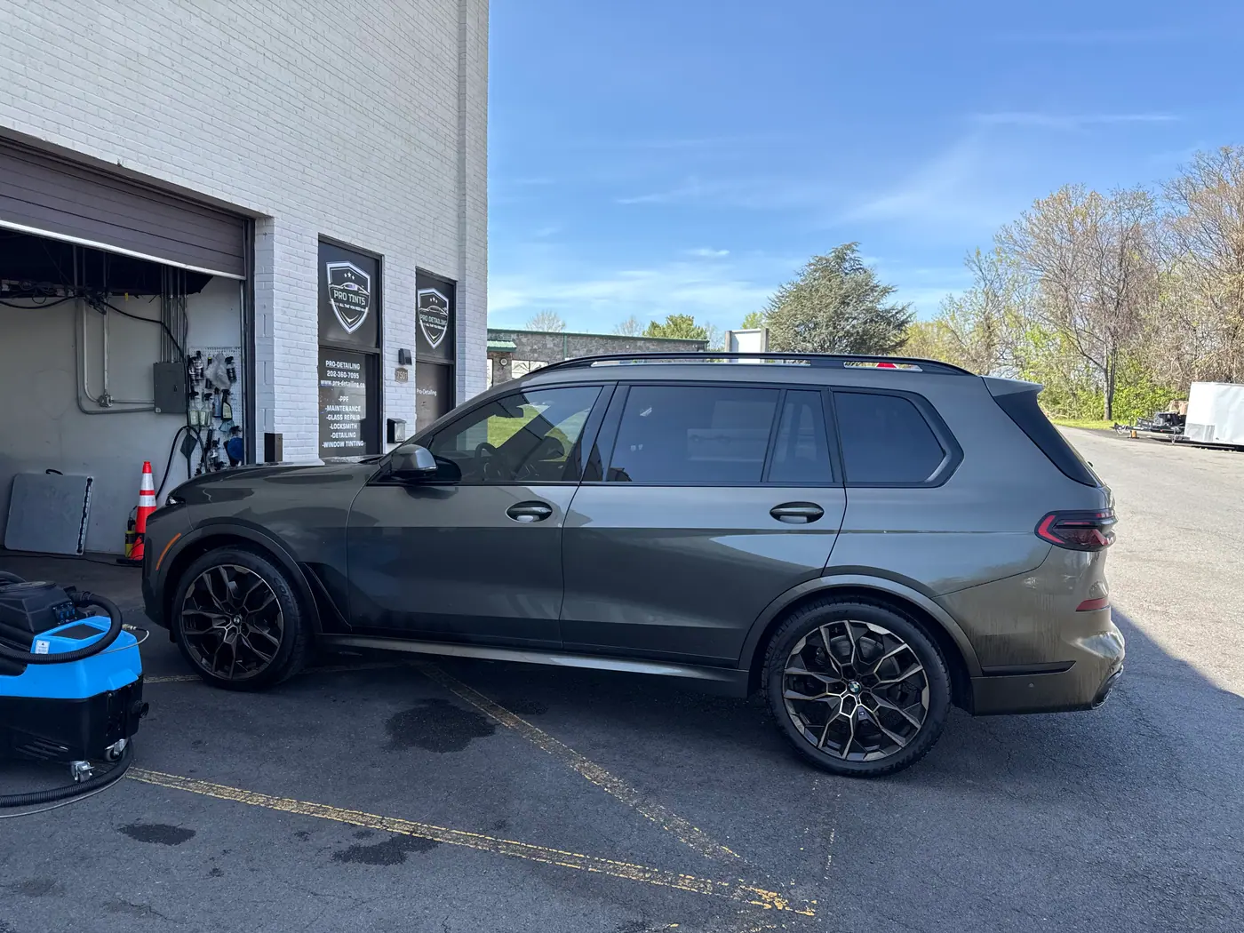 Grey SUV with tinted windows, photographed side-on.