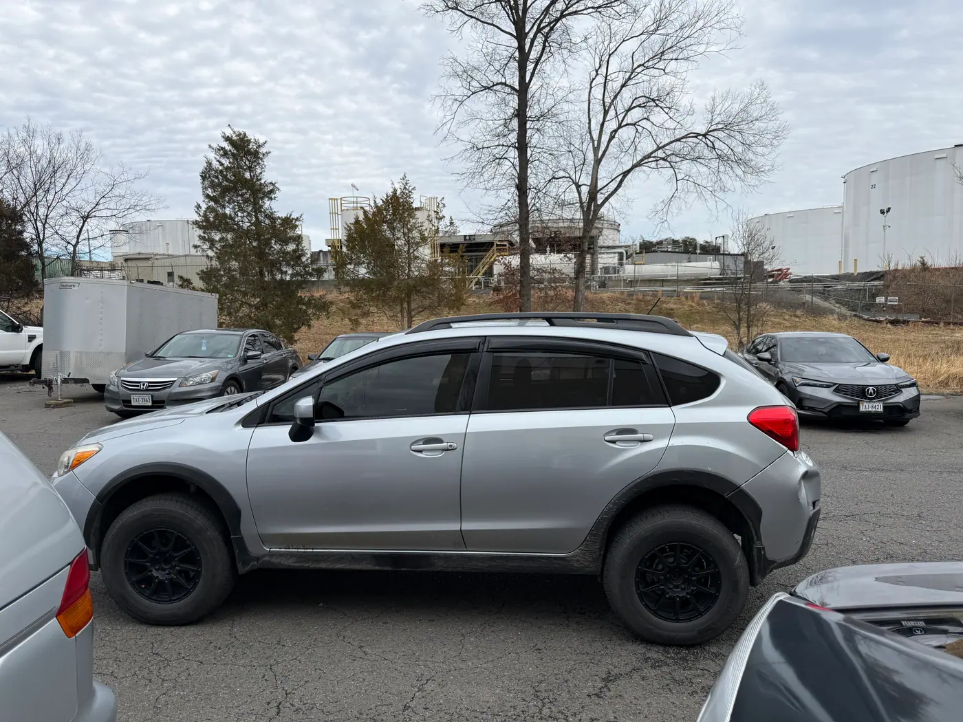 Silver crossover with tinted windows, photographed side-on.