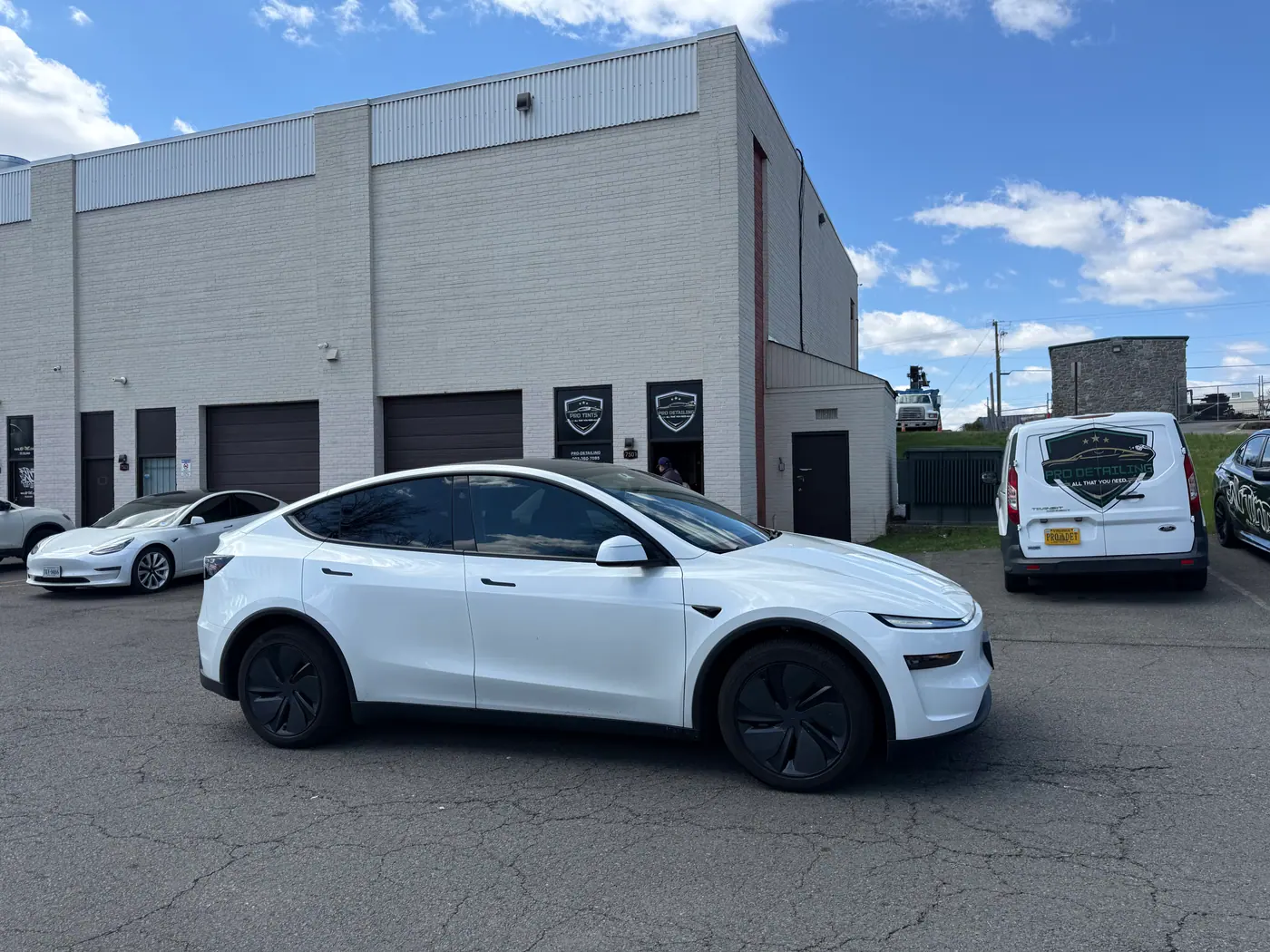 White crossover with tinted windows, photographed side-on.
