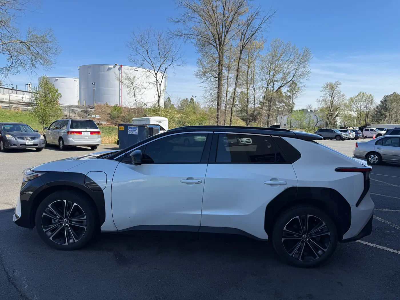 White crossover with tinted windows, photographed side-on.