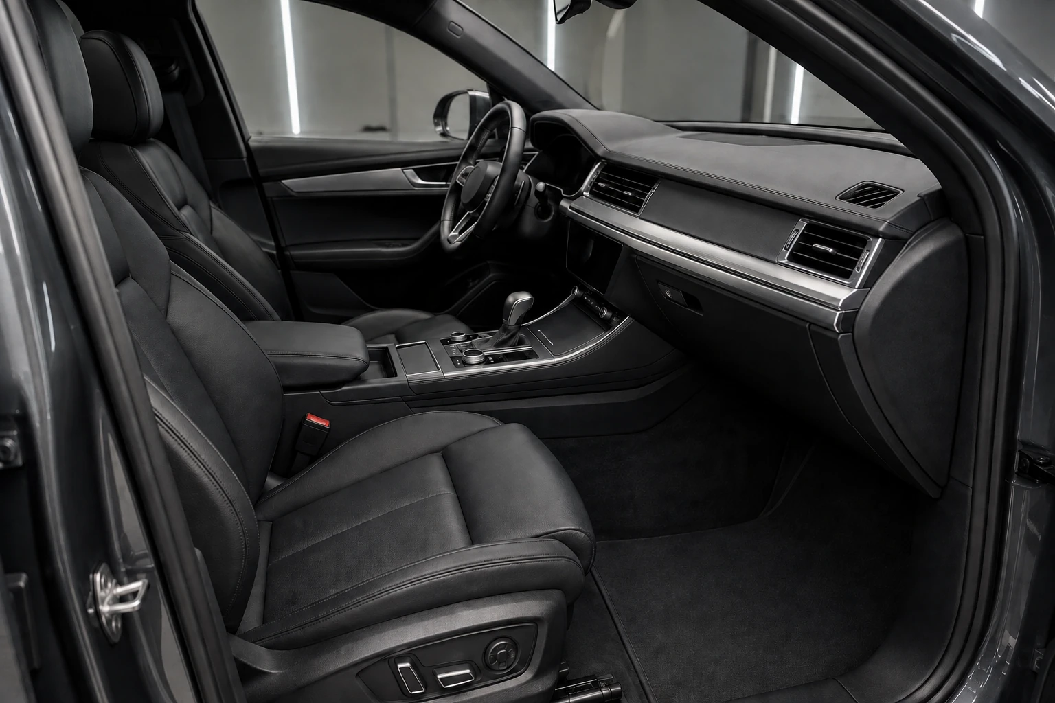 Carefully finished premium black-leather front cabin and dashboard.