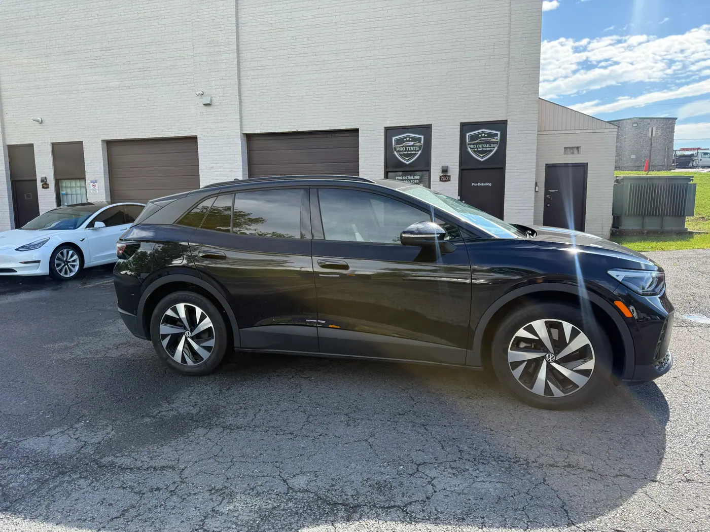 Black crossover with tinted windows, photographed side-on: window tint by PRO Detailing, serving Chantilly, VA drivers.