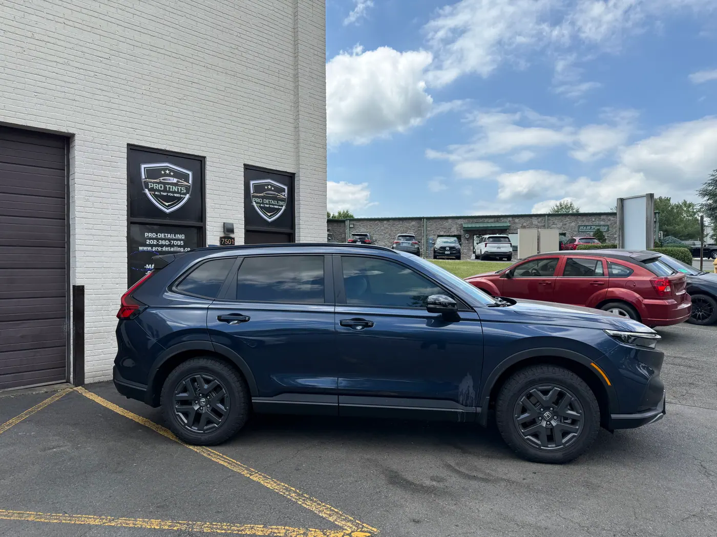 Blue SUV with tinted windows, photographed side-on: window tint by PRO Detailing, serving Woodbridge, VA drivers.