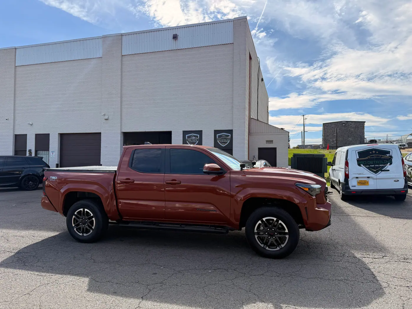 Copper pickup truck with tinted windows, photographed side-on: window tint by PRO Detailing, serving Haymarket, VA drivers.