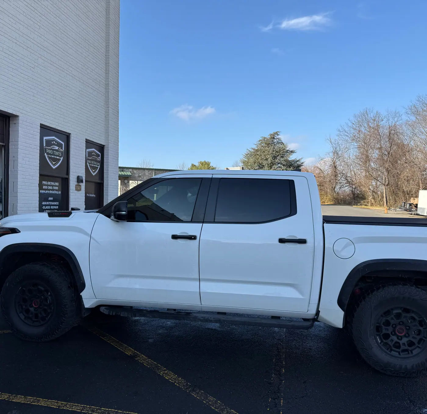 White pickup truck with tinted windows, photographed side-on: window tint by PRO Detailing, serving Haymarket, VA drivers.