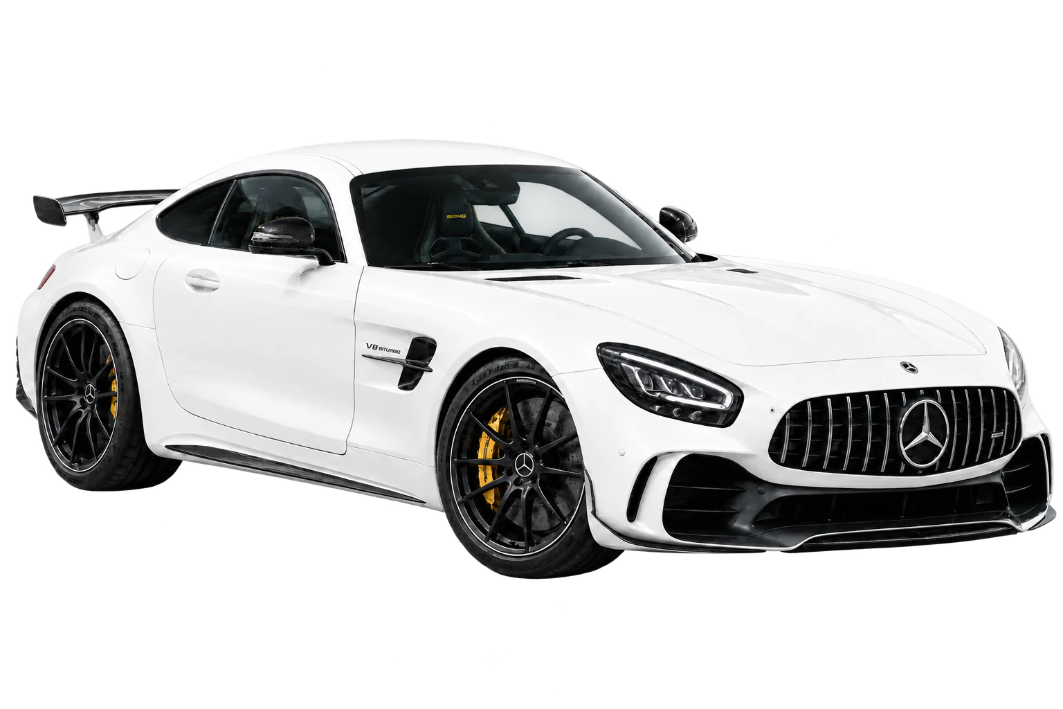 White performance coupe presented against a dark studio background